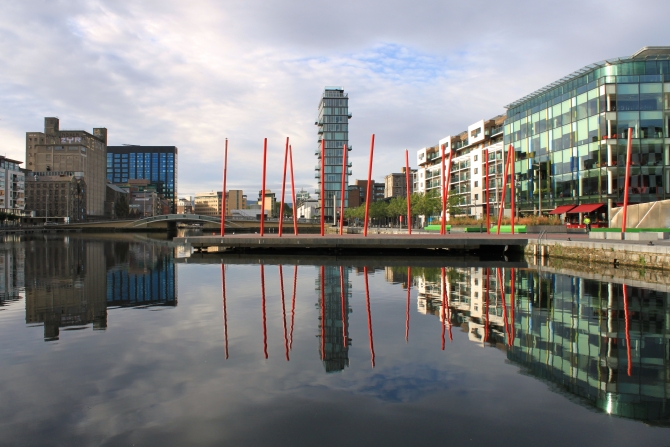 Offices and apartments reflected in Grand Canal Dock Dublin city.