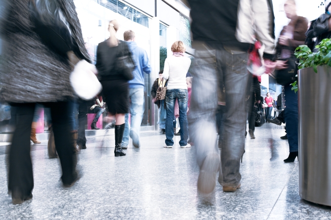 Photo of the shoppers at shopping center, motion blur