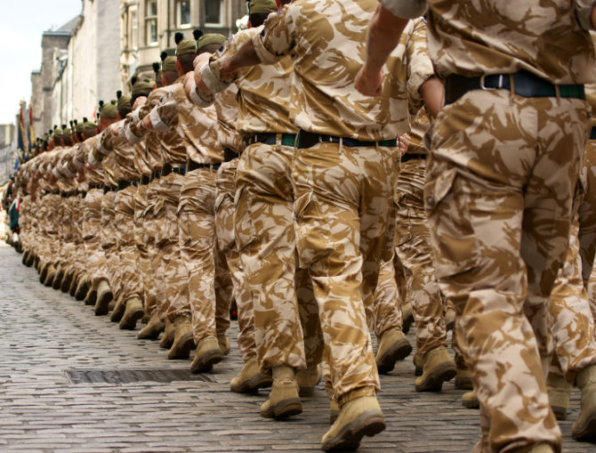 british army soldiers marching in desert camouflage uniform.