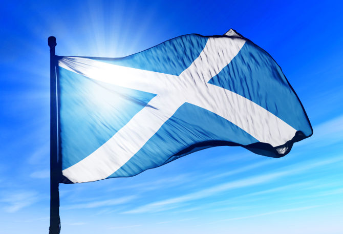 Scotland flag waving on the wind on the sky