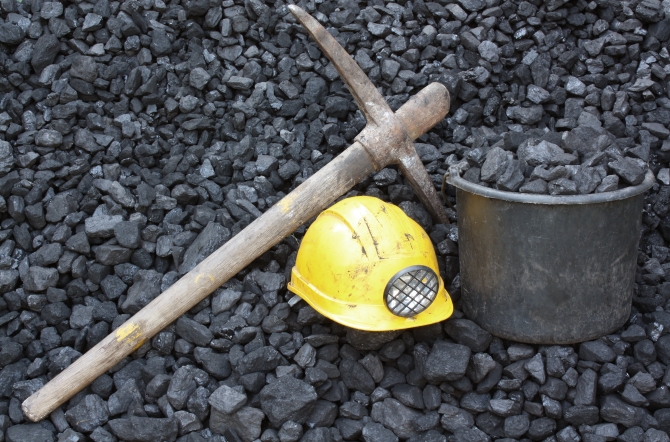 Mining tools on a background of coal