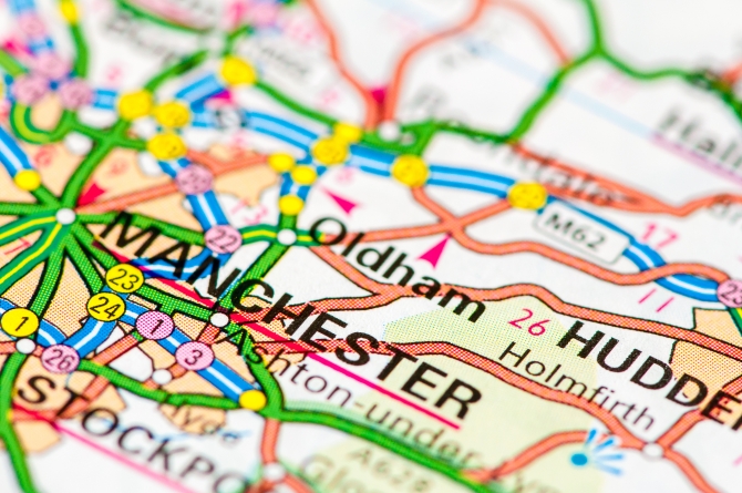 Close-up on Manchester city on map travel destination concept