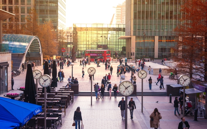 LONDON, UK - NOVEMBER 29, 2014: Canary Wharf square with lots of office workers