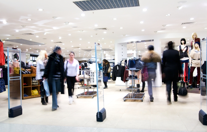 Photo of the shoppers at shopping center. Motion blur