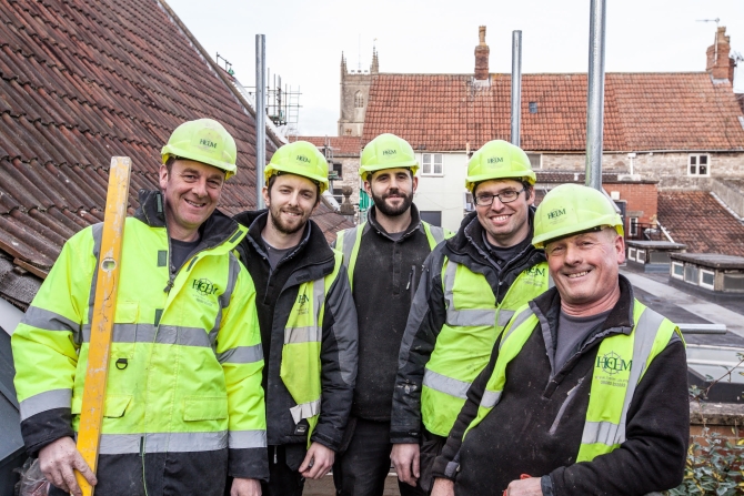 The varied ages of skilled tradesmen on a Helm Construction site at Chipping Sodbury Baptist Church