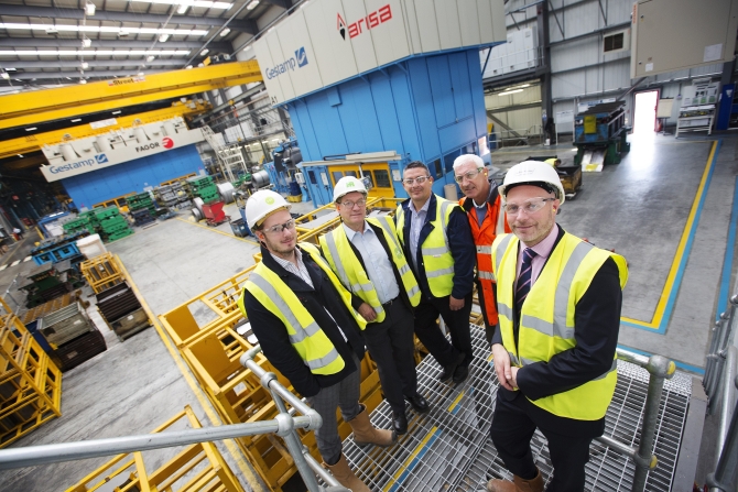 left to right: James Hall & Joe Prouse both of Horward Russell, Peter Gallone & John Langdon of Gestamp with Richard Farrey of Silverstone inside the newly completed car manufacturing plant
