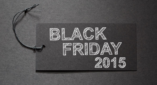 Black Friday 2015 text on a black tag on black paper background