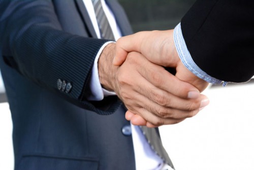 Handshake of businessmen - greeting dealing mergers and acquisition concept